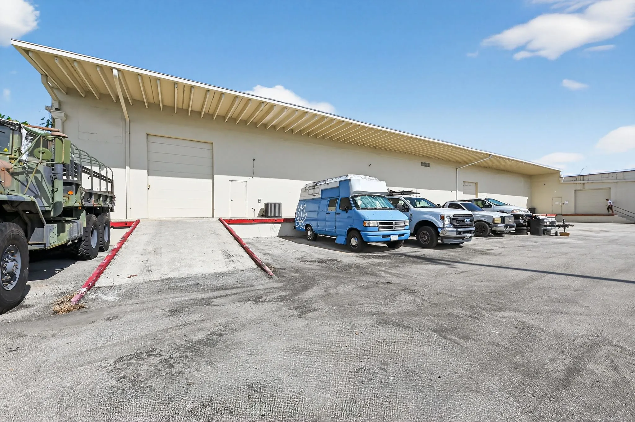 Cars parked next to each other outside a storage facility.
