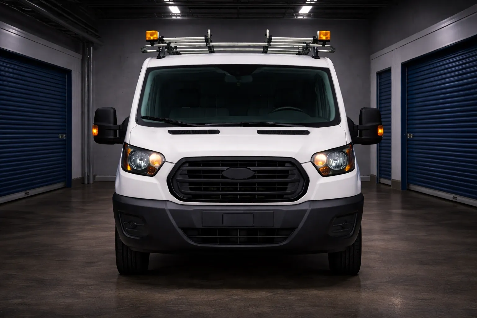 A work truck that is front facing in a storage facility.
