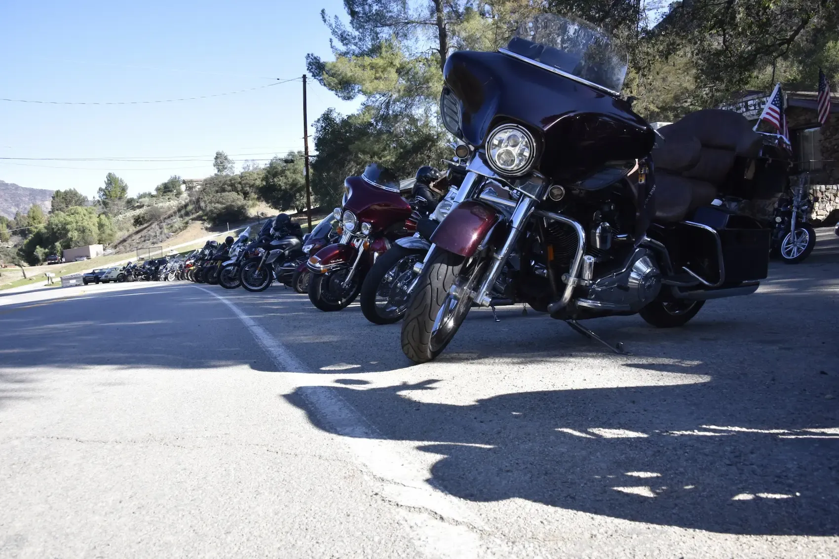 Motorcycles parked outside next to each other in a row.
