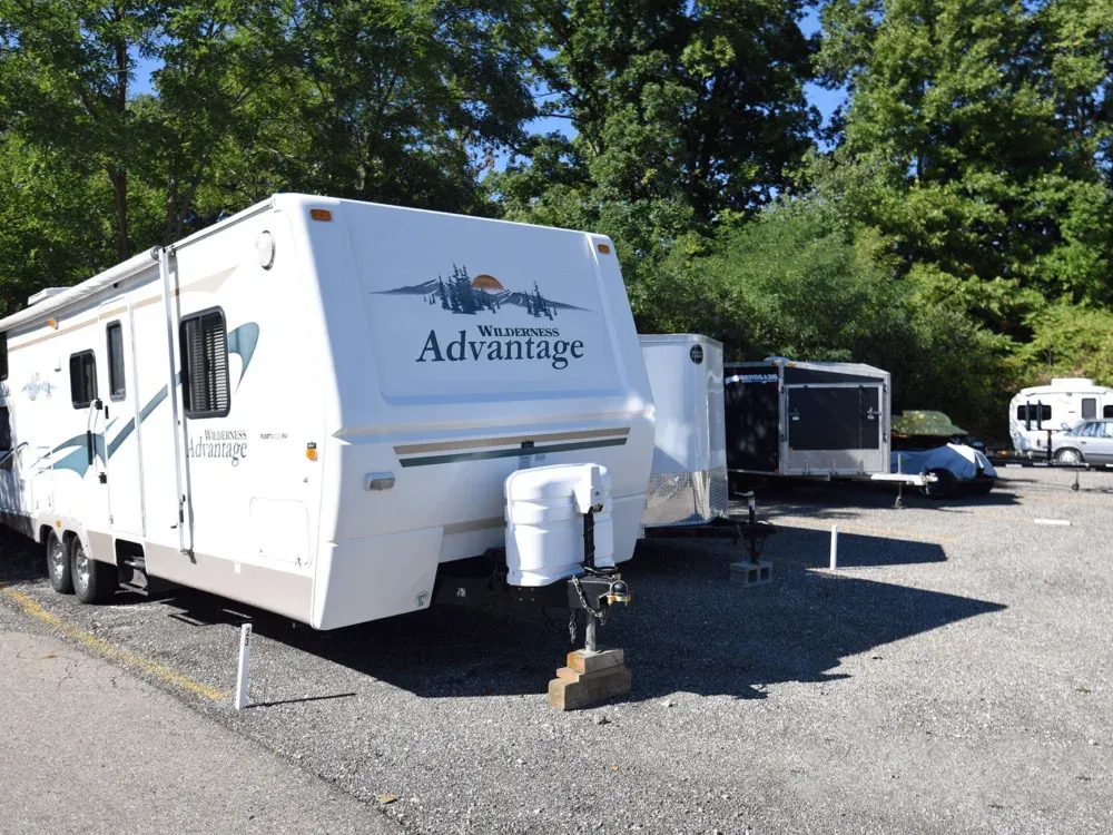 Trailer parked in space outside.